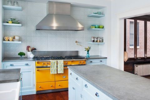 A kitchen with a stove and a sink
Description automatically generated